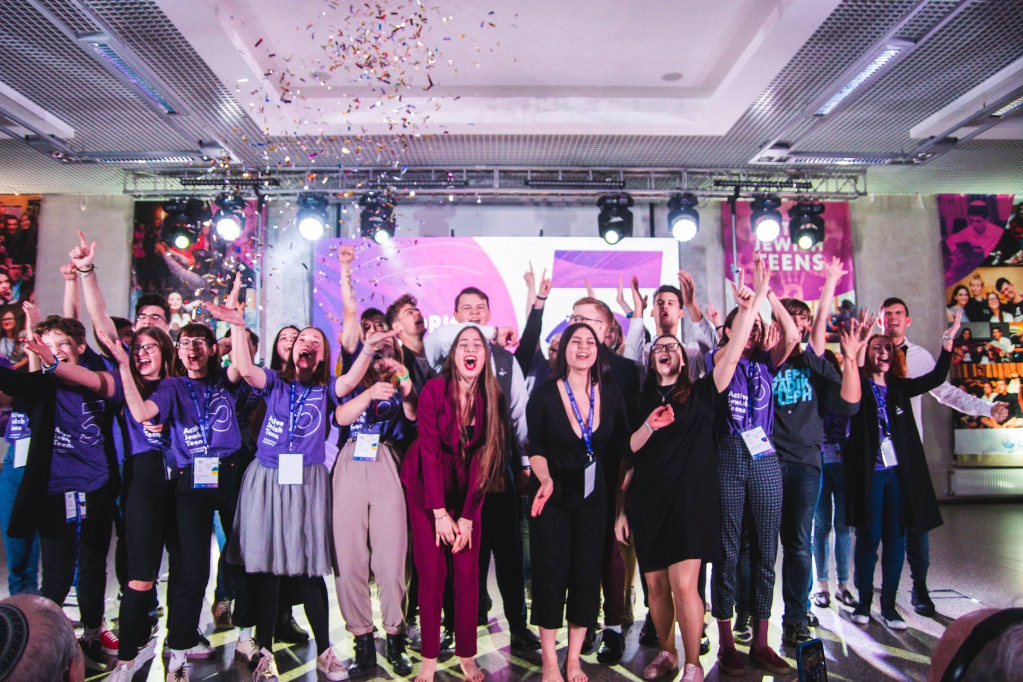 Group of people celebrating on stage