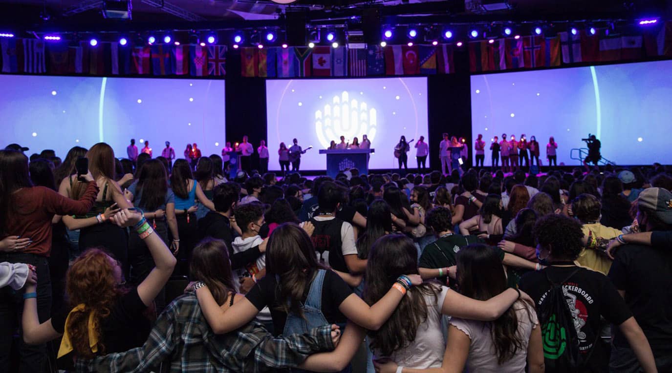 Group of diverse young people smiling at a community event
