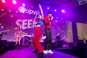 Group of people celebrating on stage