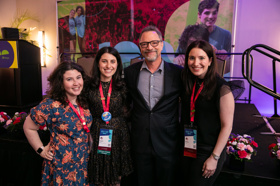 Group of people celebrating on stage