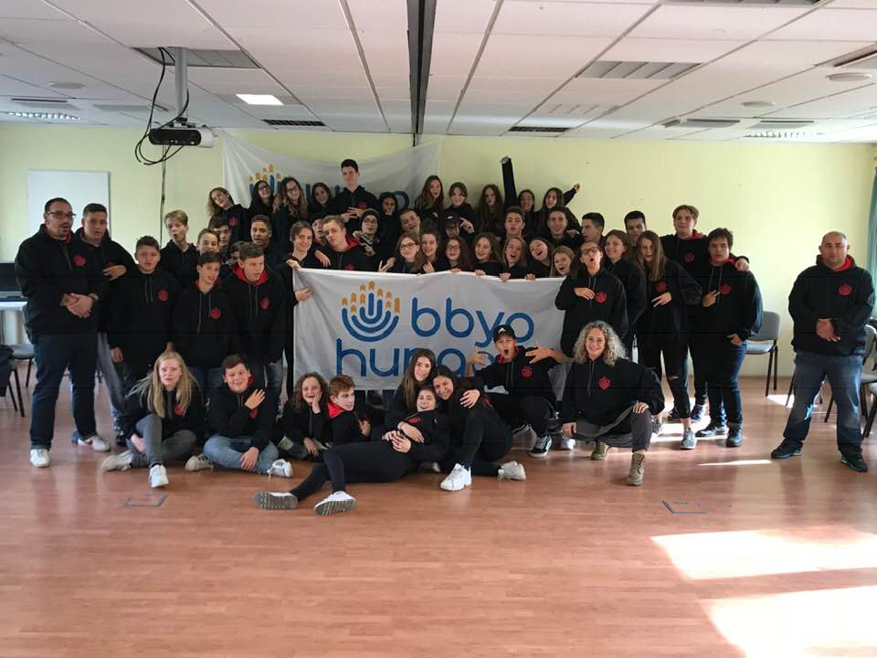 Group of people celebrating on stage