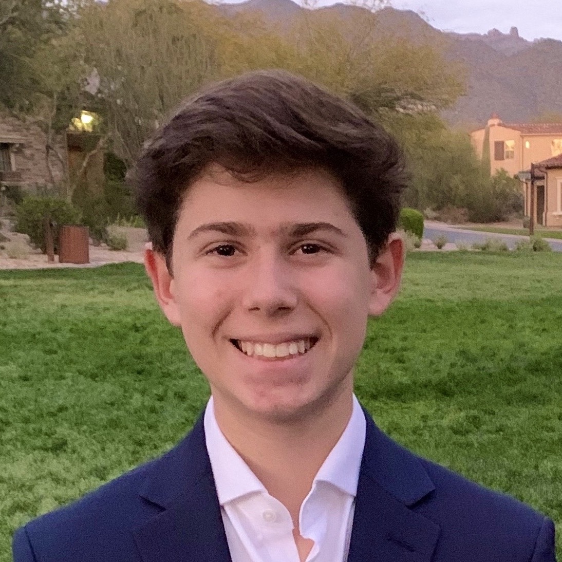A diverse group of young adults jumping with excitement in a lush green garden during a community event.