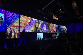 Group of people celebrating on stage