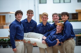 Group of people celebrating on stage