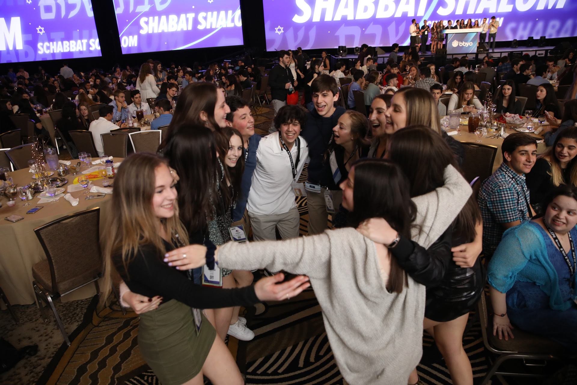 Group of people celebrating on stage