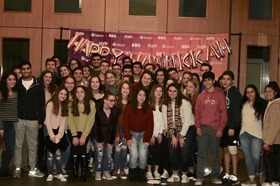 Group of people celebrating on stage