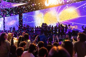 Group of people celebrating on stage