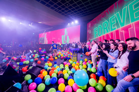 Group of people celebrating on stage