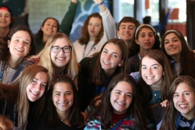 Group of people celebrating on stage