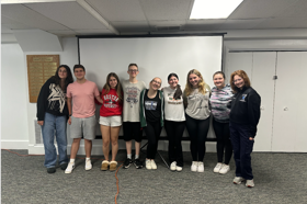Group of people celebrating on stage