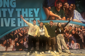 Group of people celebrating on stage