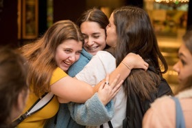 Group of people celebrating on stage