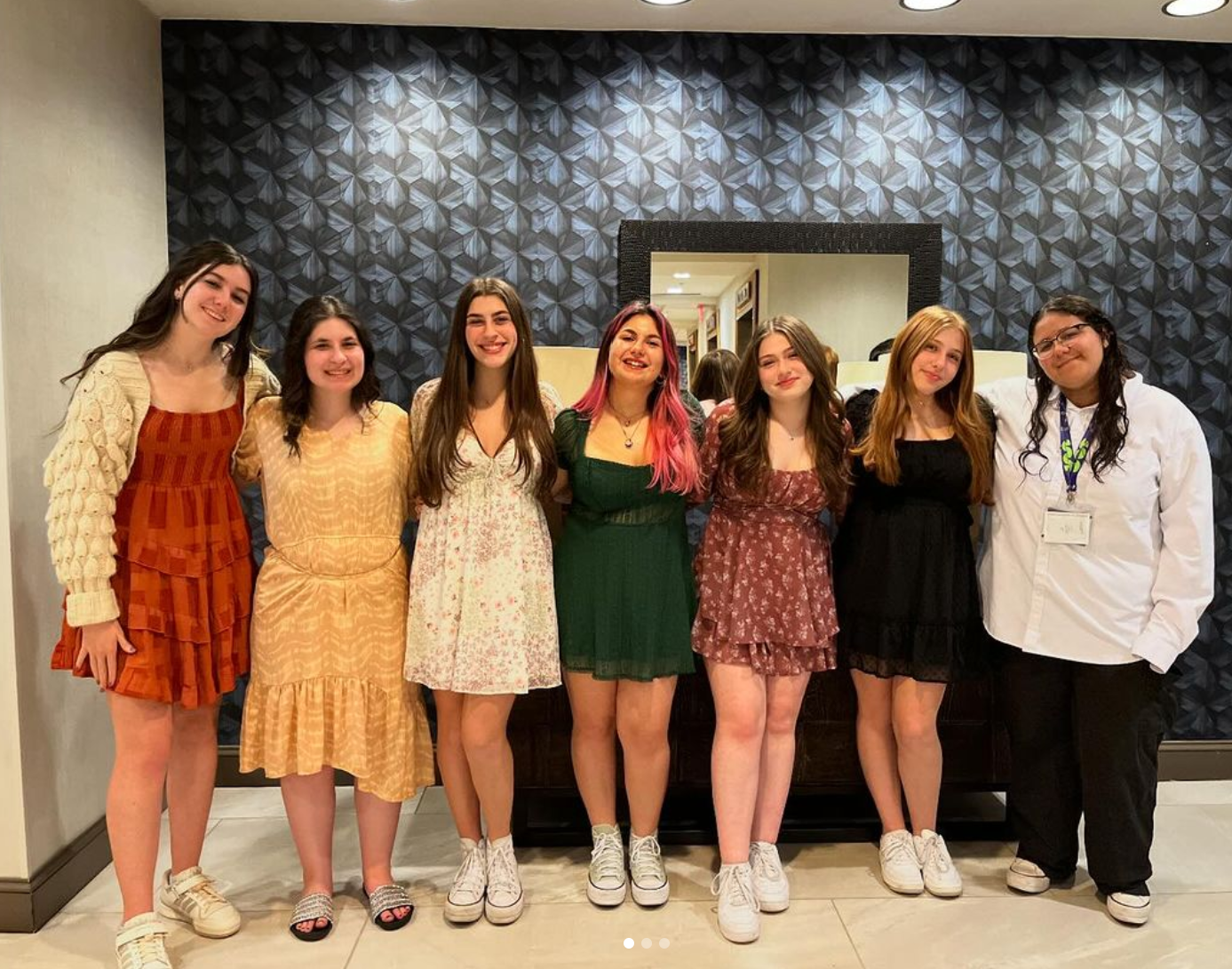 Group of people celebrating on stage