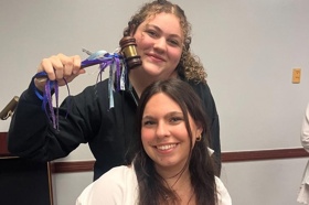 Group of people celebrating on stage