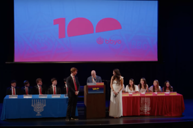 Group of people celebrating on stage