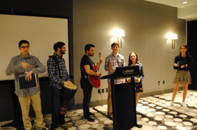 Group of people celebrating on stage