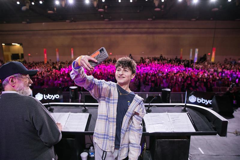 Group of people celebrating on stage