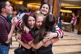Group of people celebrating on stage