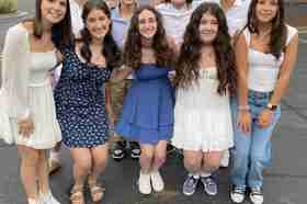 Group of people celebrating on stage