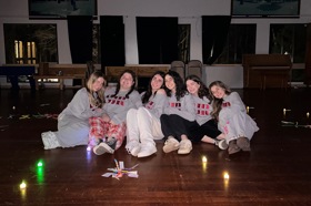 Group of people celebrating on stage