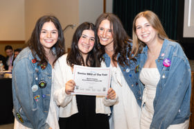 Group of people celebrating on stage