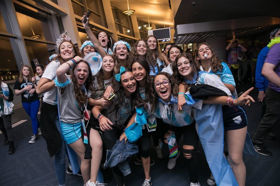 Group of people celebrating on stage