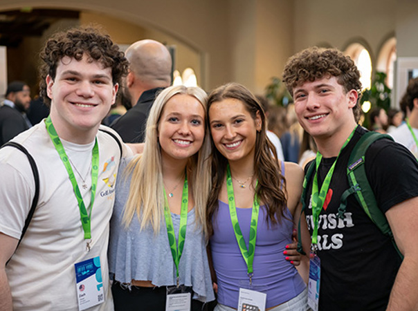 Students enjoying a summer program, standing together with name badges