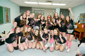 Group of people celebrating on stage