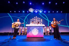 Group of people celebrating on stage