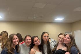 Group of people celebrating on stage