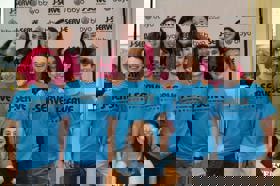 Group of people celebrating on stage