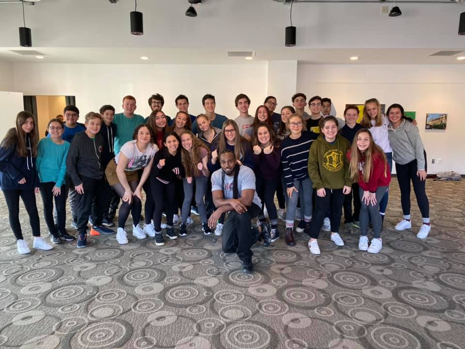 Group of people celebrating on stage