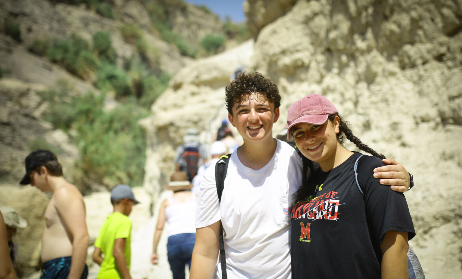 Group of diverse young people smiling at a community event