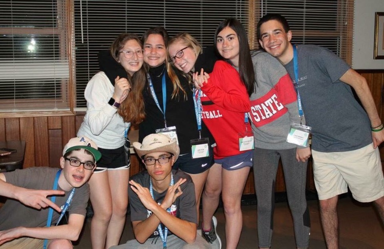 Group of people celebrating on stage