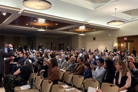 Group of people celebrating on stage
