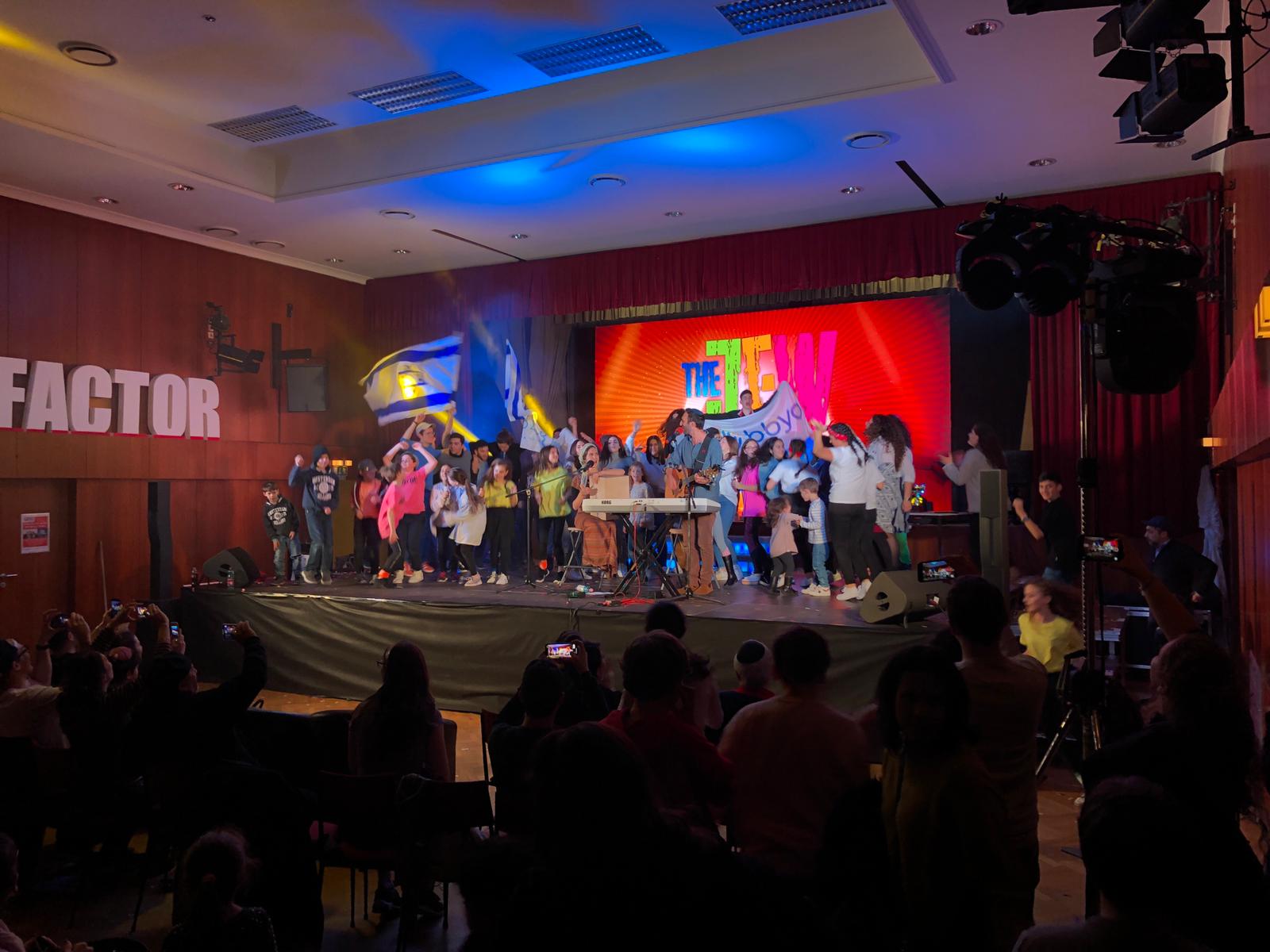 Group of people celebrating on stage