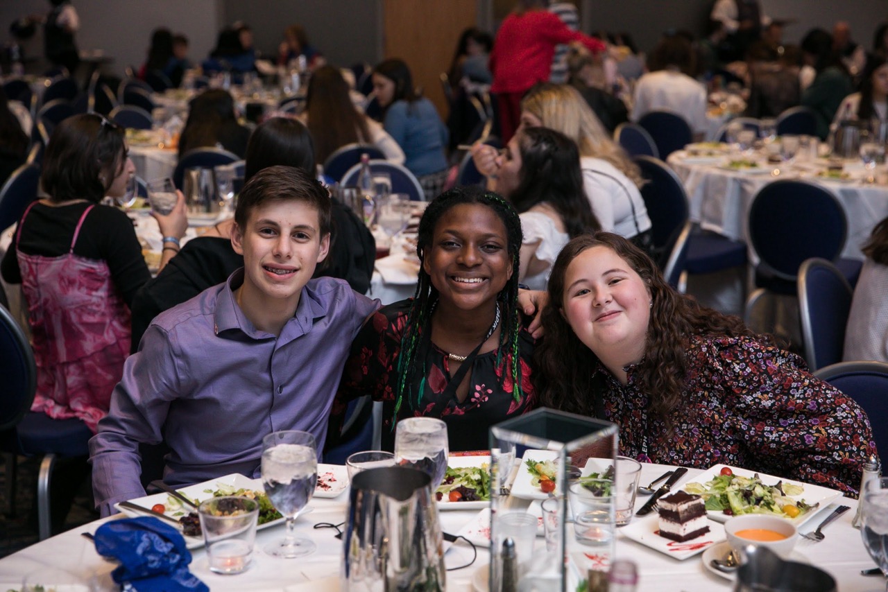 Group of people celebrating on stage