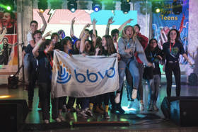 Group of people celebrating on stage