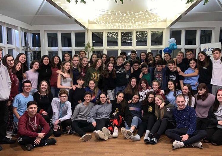 Group of people celebrating on stage