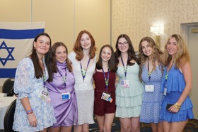 Group of people celebrating on stage