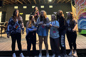 Group of people celebrating on stage