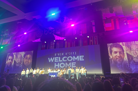 Group of people celebrating on stage